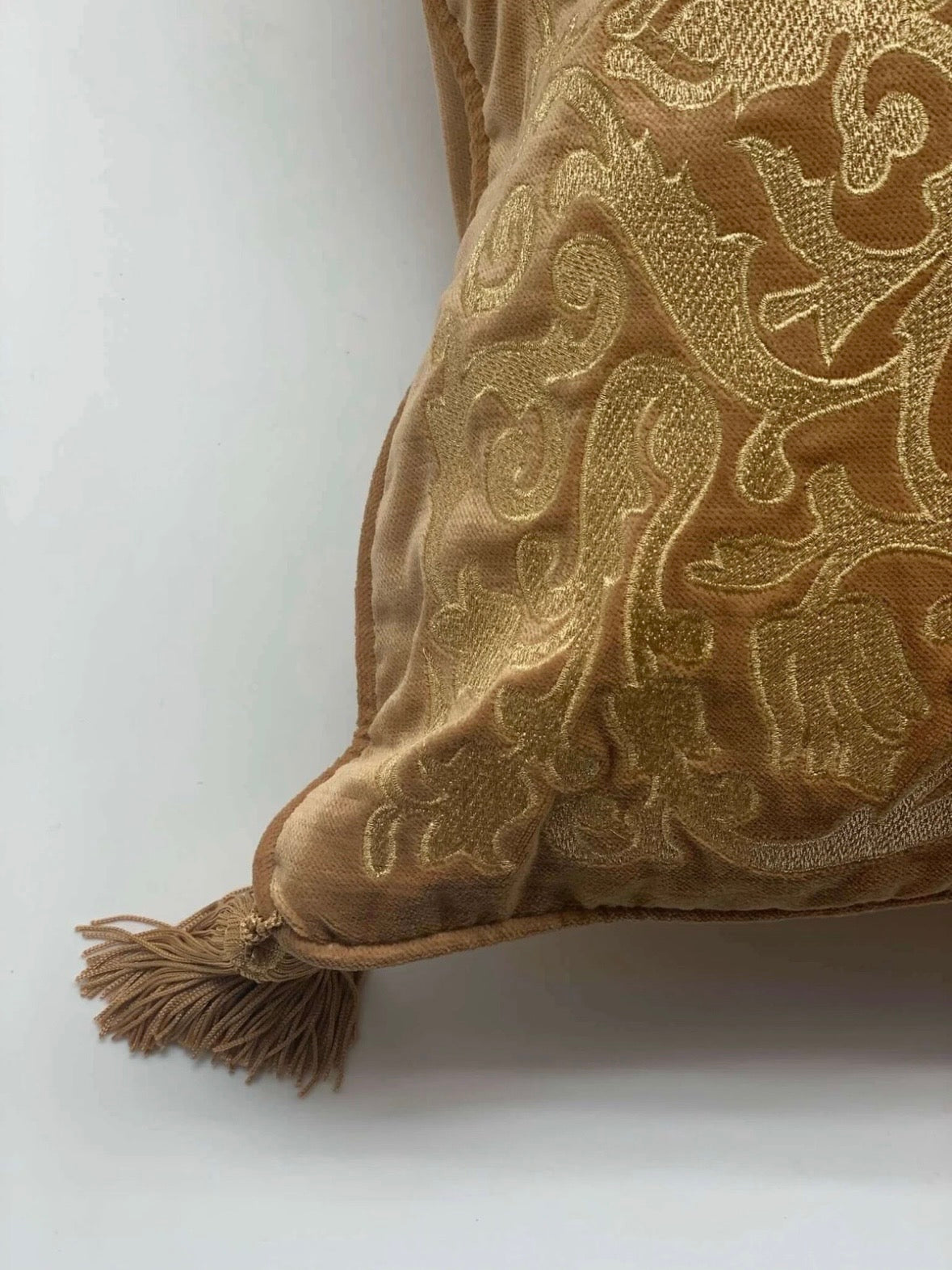 Golden embroidered tasseled cushion set of 2